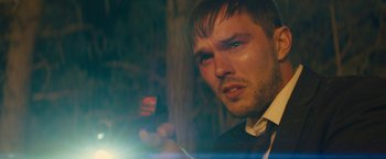 Movie still from “Those Who Wish Me Dead” (2021), directed by Taylor Sheridan – A person wearing a suit and tie; Close Up shot, Over the shoulder angle