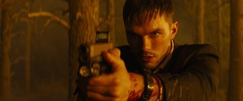 Movie still from “Those Who Wish Me Dead” (2021), directed by Taylor Sheridan – A person holding a gun in a room; Close Up shot, Low angle