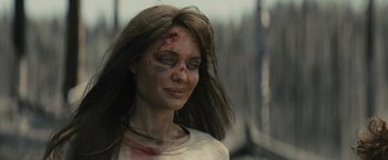Movie still from “Those Who Wish Me Dead” (2021), directed by Taylor Sheridan – A person with makeup on her face; Close Up shot, Over the shoulder angle