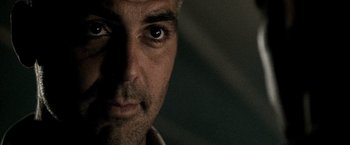 Movie still from “Three Kings” (1999), directed by David O. Russell – A man's face with his eyes wide open; Extreme Close Up shot, Low angle