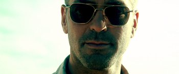 Movie still from “Three Kings” (1999), directed by David O. Russell – A person wearing sunglasses; Extreme Close Up shot, Low angle