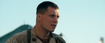 Movie still from “Three Kings” (1999), directed by David O. Russell – A person wearing a military uniform; Close Up shot, Low angle