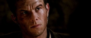 Movie still from “Three Kings” (1999), directed by David O. Russell – A person wearing a jacket; Close Up shot, Over the shoulder angle