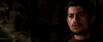 Movie still from “Three Kings” (1999), directed by David O. Russell – A person with a mustache; Close Up shot, Over the shoulder angle