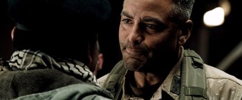 Movie still from “Three Kings” (1999), directed by David O. Russell – A person looking at another person; Close Up shot, Over the shoulder angle