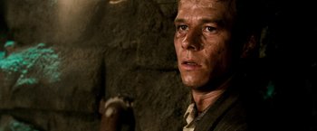 Movie still from “Three Kings” (1999), directed by David O. Russell – A person with a gun in his hand; Close Up shot, Low angle