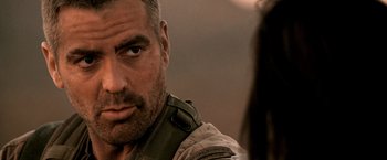 Movie still from “Three Kings” (1999), directed by David O. Russell – A person with a beard; Close Up shot, Over the shoulder angle