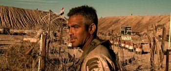 Movie still from “Three Kings” (1999), directed by David O. Russell – A man standing in front of barbed wire fence; Close Up shot, Low angle