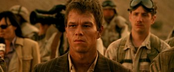 Movie still from “Three Kings” (1999), directed by David O. Russell – A person wearing a suit and tie; Close Up shot, Low angle