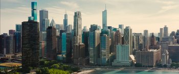 Movie still from “Ticket to Paradise” (2022), directed by Ol Parker – A view of a large city from a hill; Extreme Wide shot, High angle