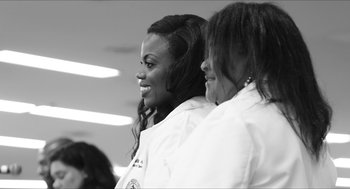 A couple of women standing next to each other