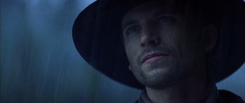 Movie still from “Timecop” (1994), directed by Peter Hyams – A person wearing a hat; Close Up shot, Low angle