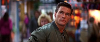 Movie still from “Timecop” (1994), directed by Peter Hyams – A person wearing a jacket; Close Up shot, Low angle