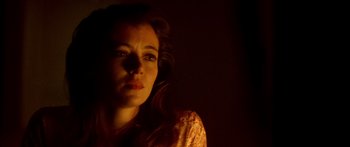 Movie still from “Timecop” (1994), directed by Peter Hyams – A person in a dark room; Close Up shot, Low angle