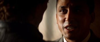 Movie still from “Timecop” (1994), directed by Peter Hyams – A man's face with his mouth open; Close Up shot, Over the shoulder angle