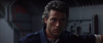 Movie still from “Timecop” (1994), directed by Peter Hyams – A person with long hair; Close Up shot, Low angle