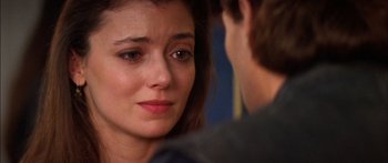 Movie still from “Timecop” (1994), directed by Peter Hyams – A person looking at another person; Close Up shot, Over the shoulder angle