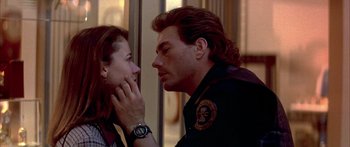 Movie still from “Timecop” (1994), directed by Peter Hyams – A man and a woman looking at one another; Close Up shot, Over the shoulder angle