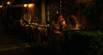 Movie still from “To Rome with Love” (2012), directed by Woody Allen – A man and a woman are sitting at a table; Medium shot, Over the shoulder angle