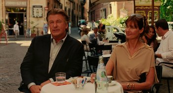 Movie still from “To Rome with Love” (2012), directed by Woody Allen – A man and a woman sitting at an outdoor table; Medium shot, Over the shoulder angle