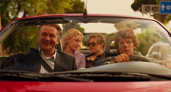 Movie still from “To Rome with Love” (2012), directed by Woody Allen – A group of people sitting in the back seat of a car; Medium shot, Over the shoulder angle