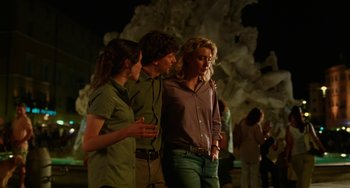 Movie still from “To Rome with Love” (2012), directed by Woody Allen – A group of people standing next to each other; Medium shot, Over the shoulder angle