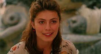 Movie still from “To Rome with Love” (2012), directed by Woody Allen – A person smiling for the camera; Close Up shot, Over the shoulder angle