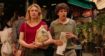 Movie still from “To Rome with Love” (2012), directed by Woody Allen – A man and a woman standing next to each other on the street; Medium shot, Low angle