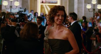 Movie still from “To Rome with Love” (2012), directed by Woody Allen – A beautiful woman in a black strapless dress; Medium shot, Over the shoulder angle