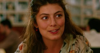 Movie still from “To Rome with Love” (2012), directed by Woody Allen – A person with a flower headband; Close Up shot, Low angle