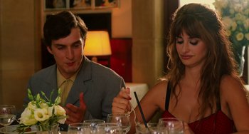 Movie still from “To Rome with Love” (2012), directed by Woody Allen – A man and a woman sitting at a dinner table; Medium shot, Over the shoulder angle