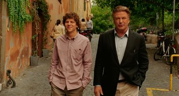 Movie still from “To Rome with Love” (2012), directed by Woody Allen – Two men walking down the street in a city; Medium shot, Over the shoulder angle