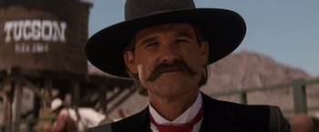 Movie still from “Tombstone” (1993), directed by George P. Cosmatos – A person wearing a hat; Close Up shot, Low angle