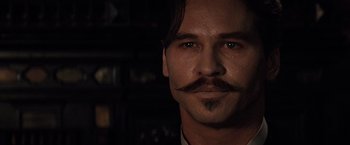 Movie still from “Tombstone” (1993), directed by George P. Cosmatos – A person with a mustache; Close Up shot, Low angle