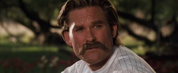 Movie still from “Tombstone” (1993), directed by George P. Cosmatos – A person with a mustache; Close Up shot, Low angle