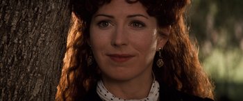 Movie still from “Tombstone” (1993), directed by George P. Cosmatos – A person with curly red hair; Close Up shot, High angle