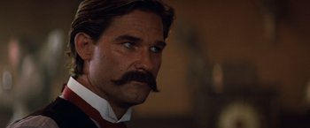 Movie still from “Tombstone” (1993), directed by George P. Cosmatos – A person with a mustache; Close Up shot, Low angle