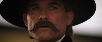 Movie still from “Tombstone” (1993), directed by George P. Cosmatos – A man with a mustache; Close Up shot, Low angle