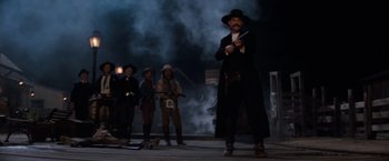 Movie still from “Tombstone” (1993), directed by George P. Cosmatos – A group of men dressed in old west costumes; Wide shot, Low angle