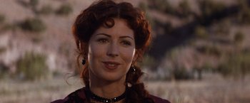 Movie still from “Tombstone” (1993), directed by George P. Cosmatos – A person wearing a necklace; Close Up shot, Low angle