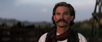 Movie still from “Tombstone” (1993), directed by George P. Cosmatos – A person with a mustache; Close Up shot, Low angle