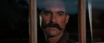 Movie still from “Tombstone” (1993), directed by George P. Cosmatos – A person with a mustache; Close Up shot, Low angle