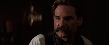 Movie still from “Tombstone” (1993), directed by George P. Cosmatos – A person with a mustache; Close Up shot, Low angle