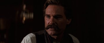 Movie still from “Tombstone” (1993), directed by George P. Cosmatos – A person with a mustache; Close Up shot, Low angle