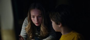 Movie still from “Tomorrowland” (2015), directed by Brad Bird – A woman and a boy are talking to each other; Close Up shot, Over the shoulder angle