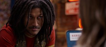 Movie still from “Tomorrowland” (2015), directed by Brad Bird – A person with dreadlocks; Close Up shot, Over the shoulder angle