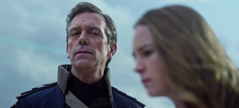 Movie still from “Tomorrowland” (2015), directed by Brad Bird – A man and a woman looking at one another; Close Up shot, Over the shoulder angle