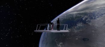 Movie still from “Tomorrowland” (2015), directed by Brad Bird – A group of people standing on top of a platform; Extreme Wide shot, High angle