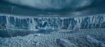 Movie still from “Tomorrowland” (2015), directed by Brad Bird – A view of a frozen lake with a storm in the background; Extreme Wide shot, Overhead angle