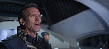 Movie still from “Tomorrowland” (2015), directed by Brad Bird – A person wearing a hat; Close Up shot, Low angle